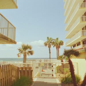 a row of buildings next to a beach